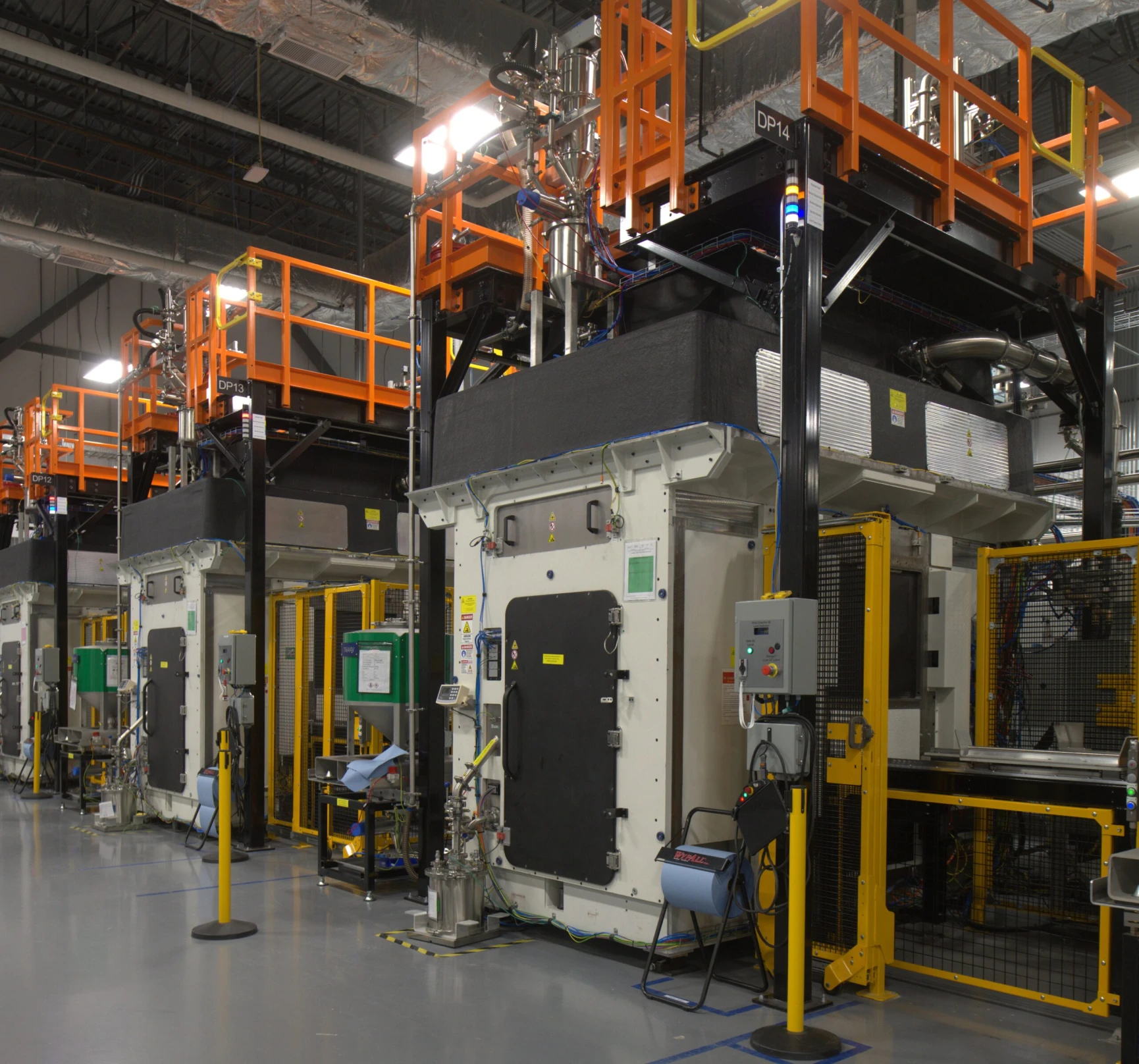 Row of VulcanForms industrial metal additive manufacturing machines