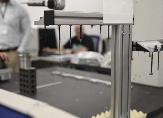 Precision measuring equipment is set up in a lab, highlighting quality control in consumer goods manufacturing.